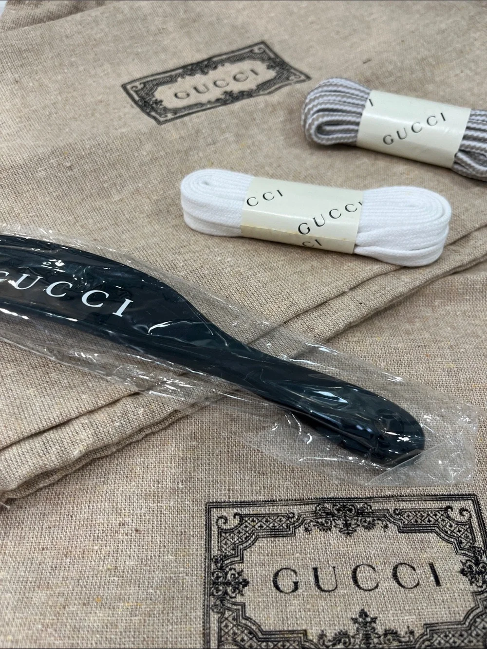 Gucci Beige Branded Dust Bags with Black Strap and White/Gray Laces